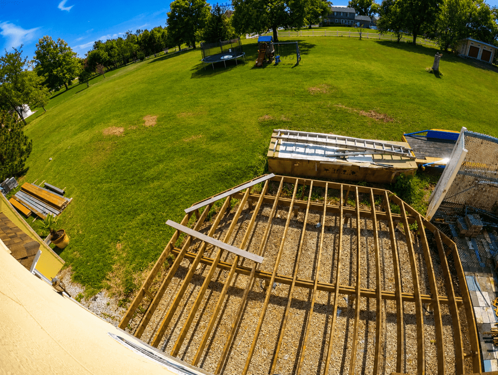 Aluminum glass railing installed on composite deck with clear tempered glass panels