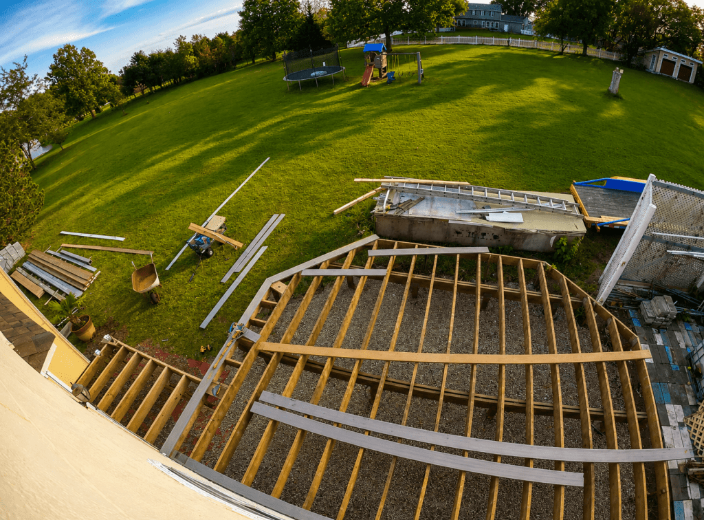 Glass railing panel inserted into aluminum top and bottom rail channel