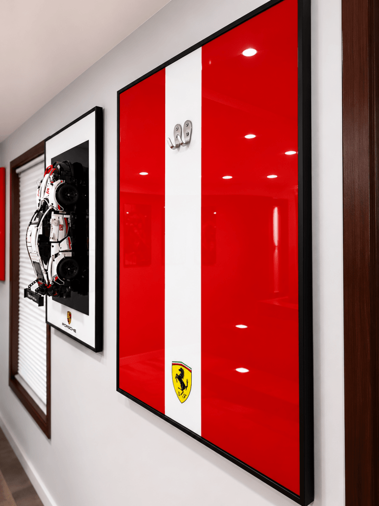 LEGO Technic display frame hardware showing acrylic backing and mounting bracket